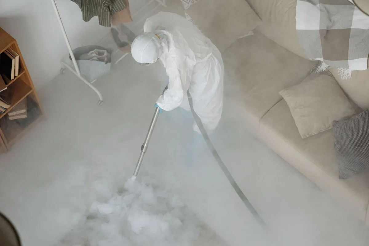 Biohazard cleanup technician in protective equipment, Monticello, NY